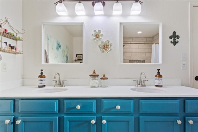 bathroom featuring vanity and curtained shower