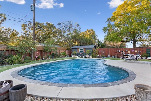 view of pool featuring a patio area and an outdoor structure