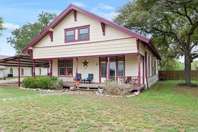 view of front facade featuring covered porch and a front yard