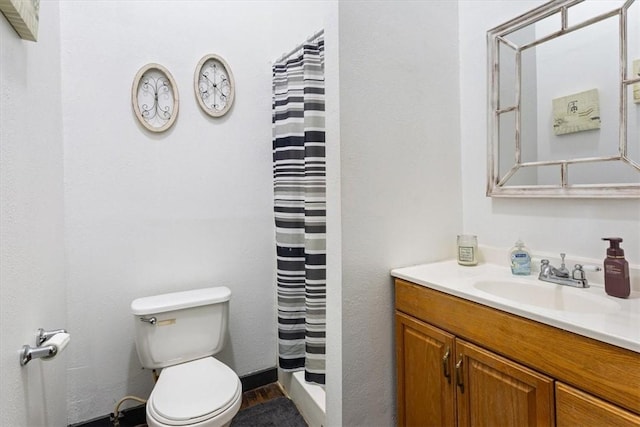 bathroom with vanity, curtained shower, toilet, and wood-type flooring