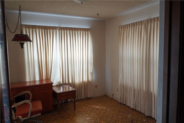 interior space featuring a textured ceiling