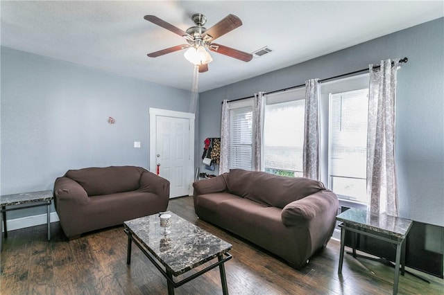 living room featuring dark hardwood / wood-style floors and ceiling fan