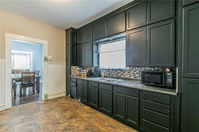 kitchen featuring sink and tasteful backsplash