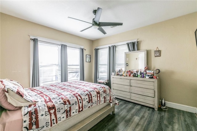 bedroom with ceiling fan and dark hardwood / wood-style floors