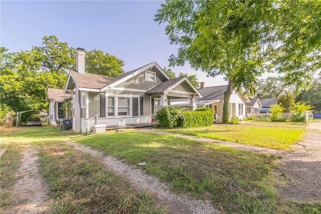 bungalow-style house with a front yard