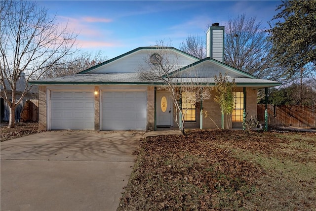 ranch-style home featuring a garage