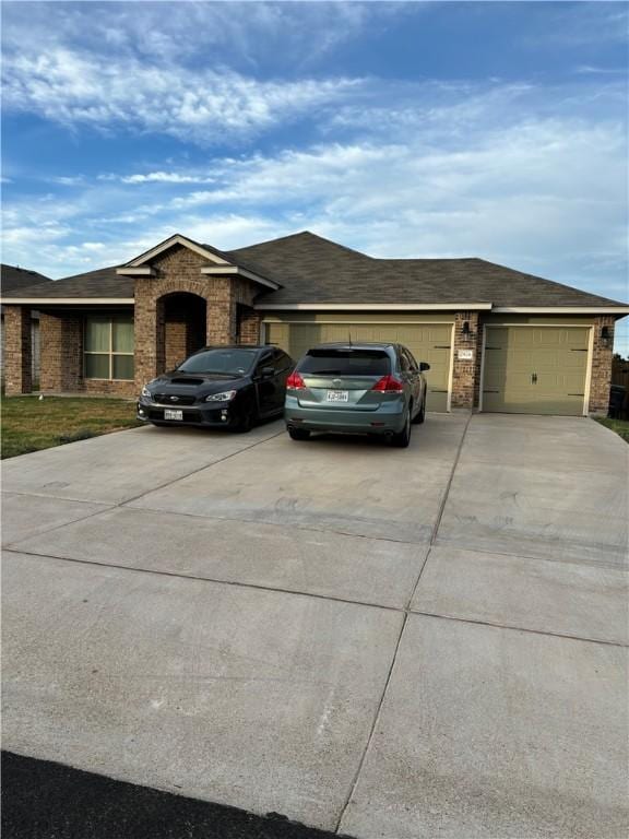 ranch-style home featuring a garage