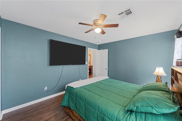 bedroom with ceiling fan, wood finished floors, visible vents, and baseboards