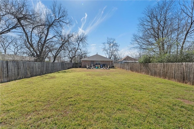 view of yard featuring a fenced backyard