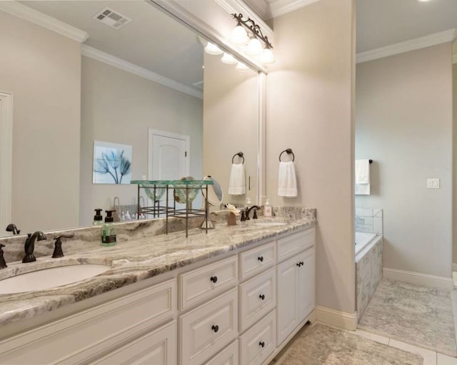 bathroom with crown molding, vanity, and tiled tub