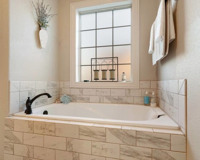 bathroom with tiled bath