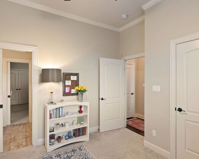 interior space with crown molding and light carpet