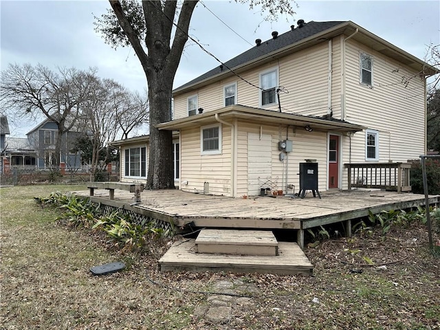 back of house featuring a deck