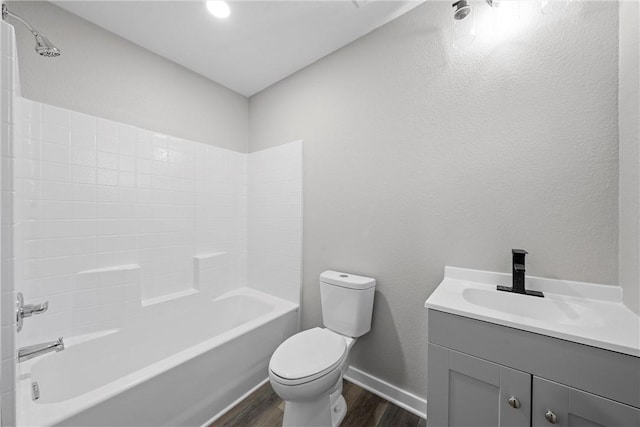 full bathroom featuring shower / bathing tub combination, wood-type flooring, vanity, and toilet