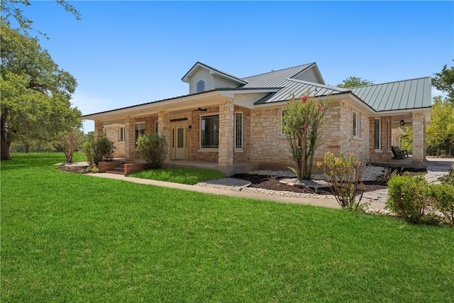 view of front of home featuring a front yard and covered porch