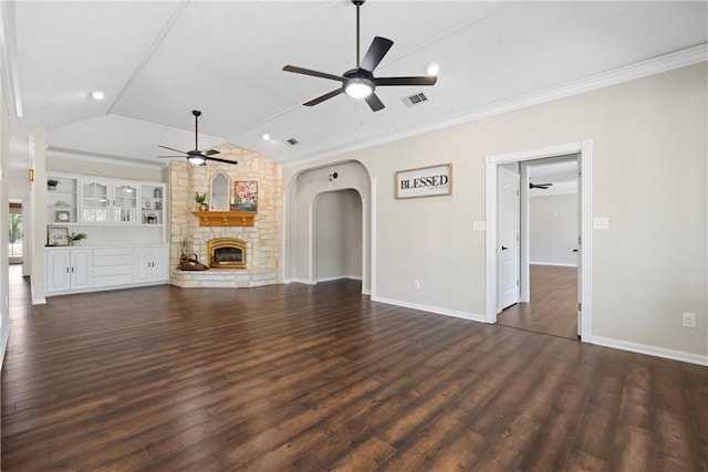 unfurnished living room with a fireplace, dark wood-type flooring, vaulted ceiling, and ornamental molding