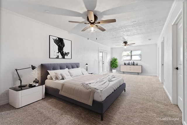 carpeted bedroom featuring ornamental molding and a textured ceiling