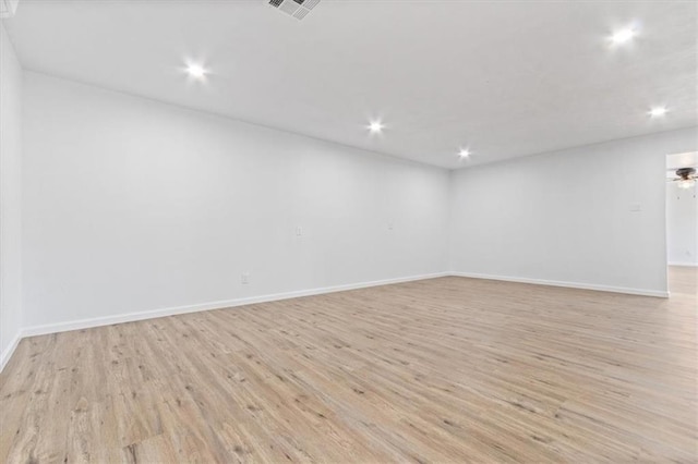 spare room featuring ceiling fan and light wood-type flooring