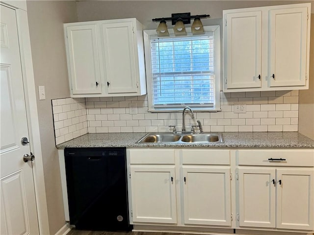 kitchen with white cabinetry, sink, decorative backsplash, and dishwasher