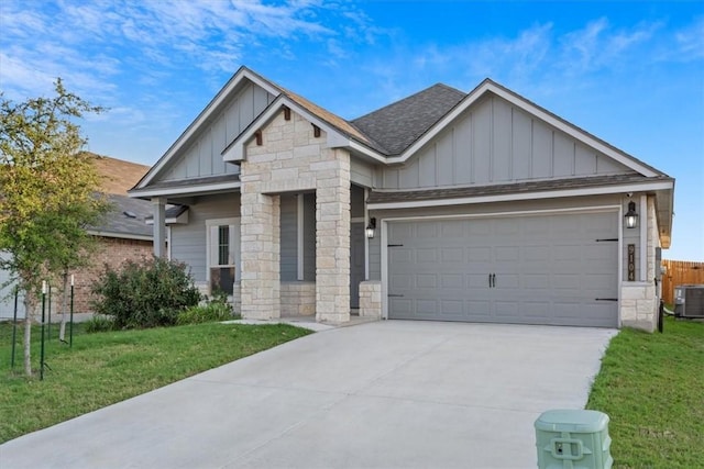 craftsman-style house with a front yard and a garage