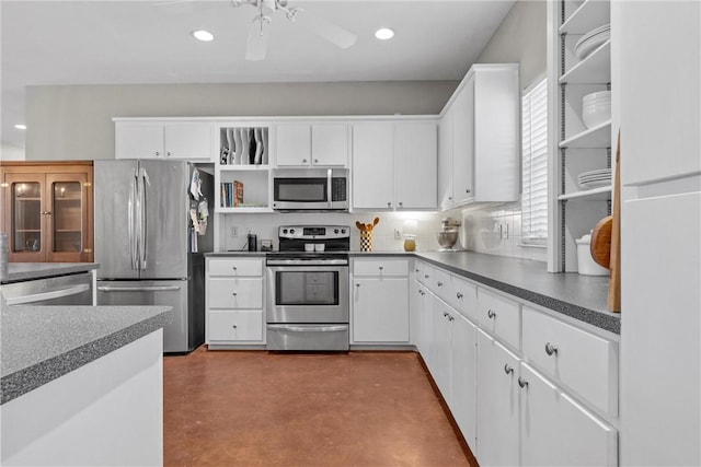 kitchen featuring concrete flooring, stainless steel appliances, open shelves, and white cabinetry