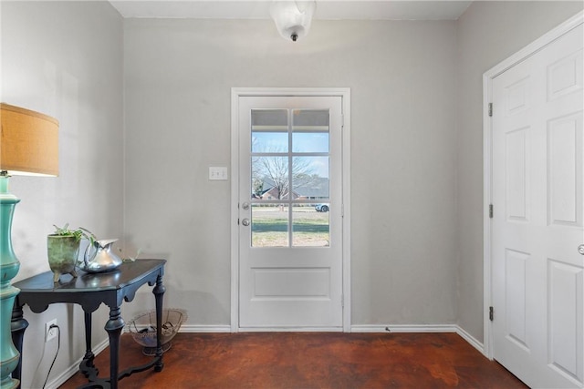 entryway featuring baseboards