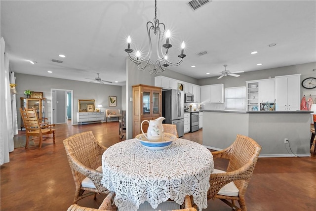 dining area featuring ceiling fan with notable chandelier, finished concrete floors, visible vents, and recessed lighting