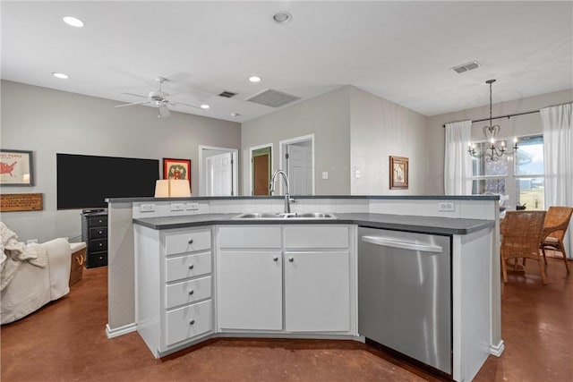 kitchen featuring visible vents, dishwasher, dark countertops, concrete flooring, and a sink