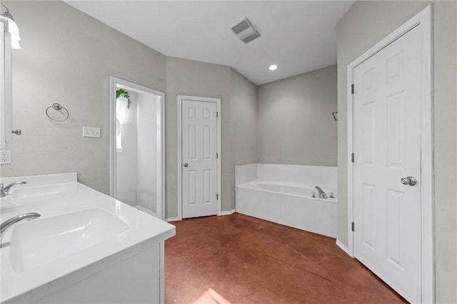 bathroom featuring double vanity, visible vents, a bath, concrete flooring, and a sink