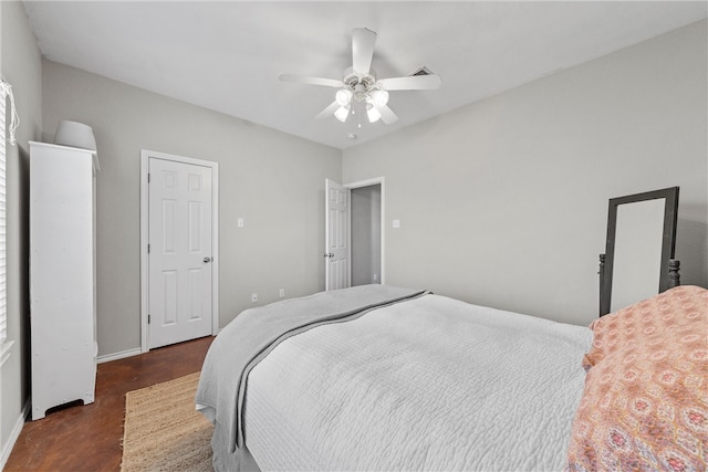 bedroom featuring a ceiling fan and baseboards