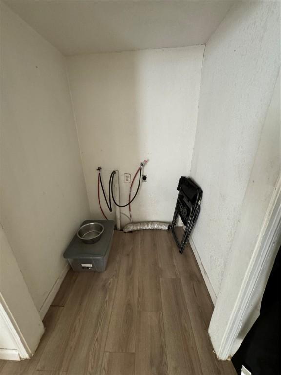 laundry room with hookup for a washing machine and hardwood / wood-style floors