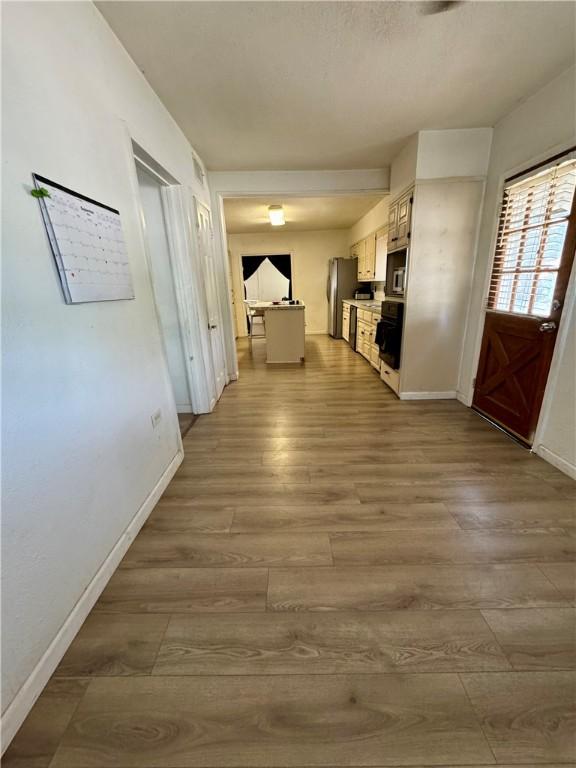 hallway featuring wood-type flooring