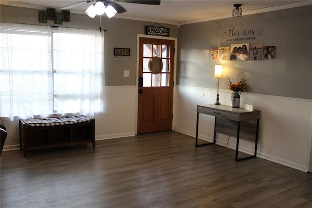 entryway featuring crown molding, dark wood-type flooring, and ceiling fan