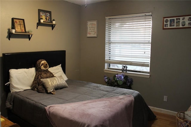 bedroom featuring hardwood / wood-style floors