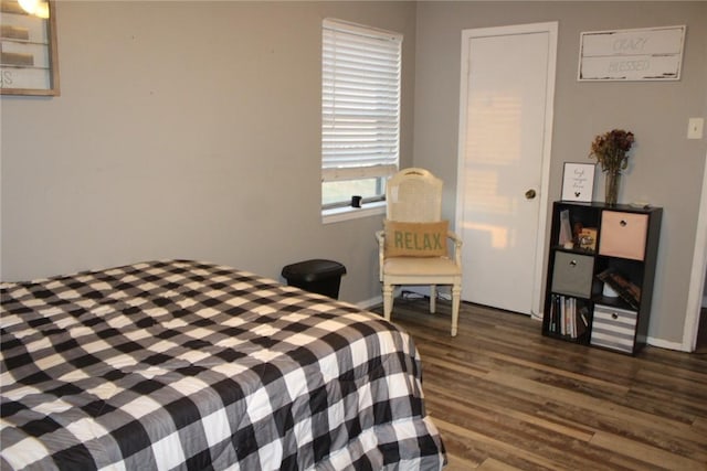 bedroom featuring dark hardwood / wood-style flooring