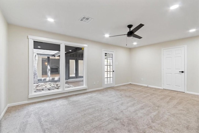 unfurnished room featuring carpet and ceiling fan