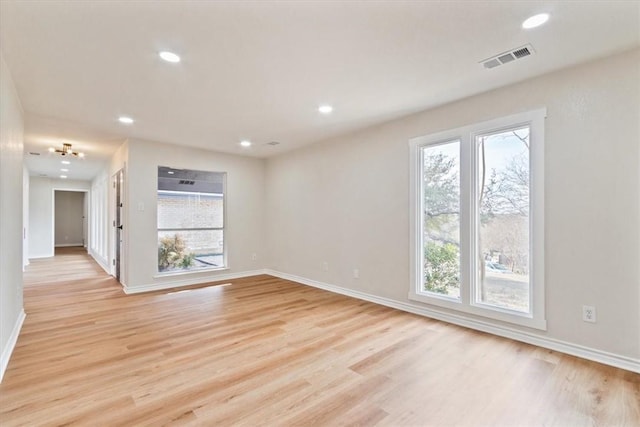 unfurnished room with light hardwood / wood-style floors