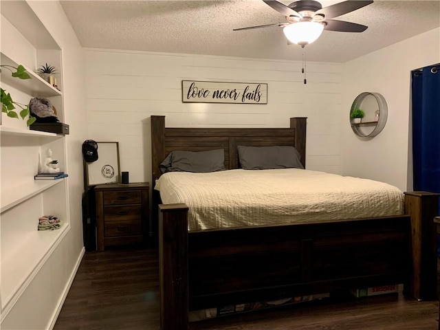 bedroom featuring a textured ceiling, a ceiling fan, and wood finished floors