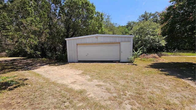 garage with a yard