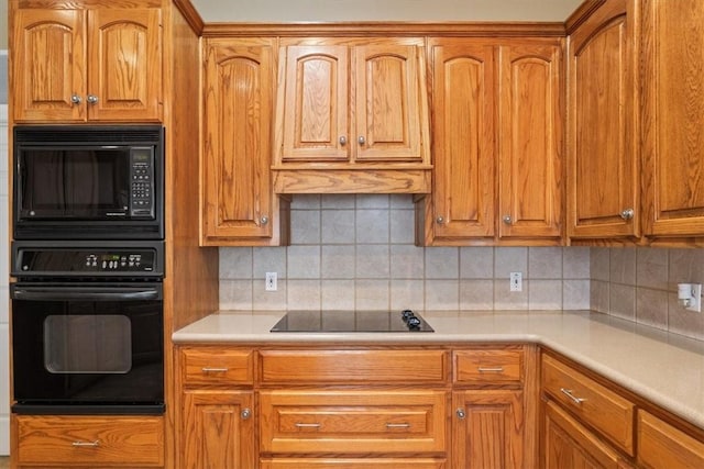 kitchen with decorative backsplash and black appliances