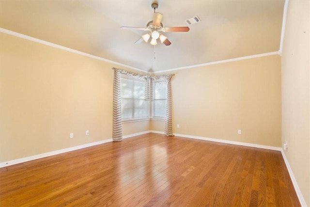 spare room featuring ceiling fan, ornamental molding, and hardwood / wood-style floors