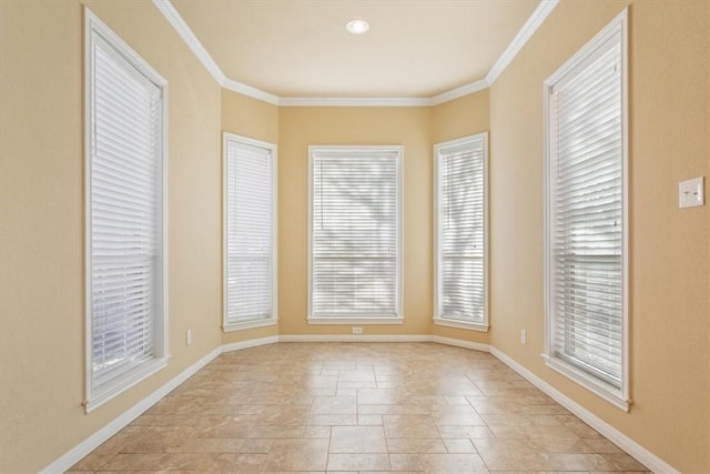 spare room with crown molding