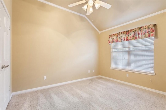 carpeted spare room with ceiling fan, lofted ceiling, and ornamental molding