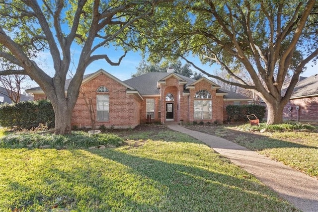 ranch-style house with a front yard