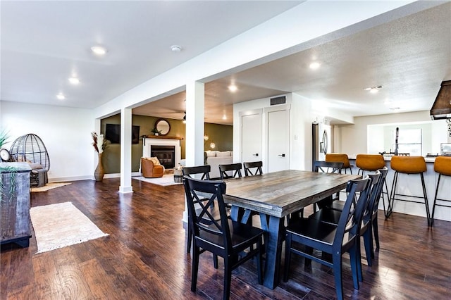 dining area with dark hardwood / wood-style flooring