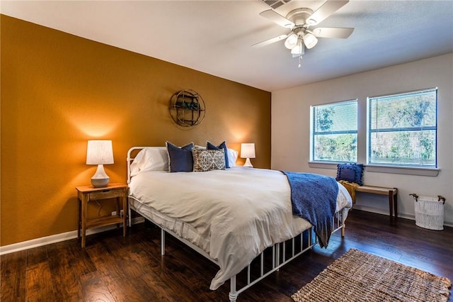 bedroom with ceiling fan and dark hardwood / wood-style floors