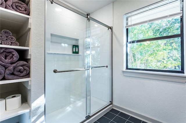 bathroom featuring tile patterned floors and walk in shower