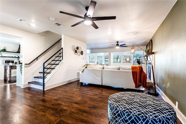 living room with dark hardwood / wood-style floors and ceiling fan