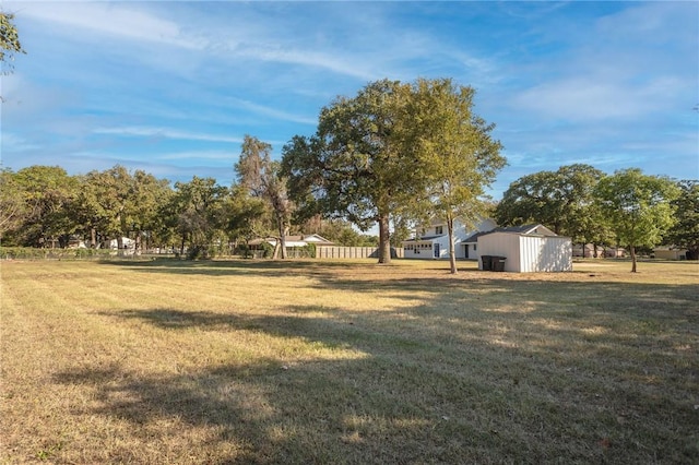 view of yard with a storage unit