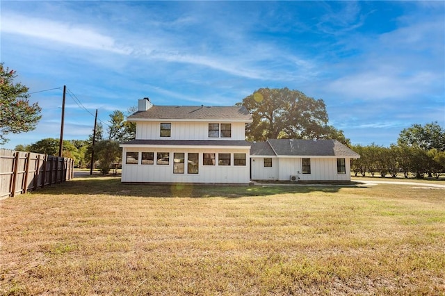 back of house with a yard